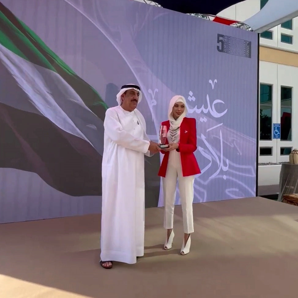 Mai Majdy's honored award by ENOC LLC as a creative artist during the celebrations of the UAE National Day 2022.